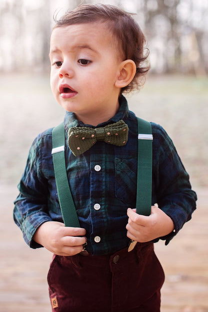 Blue suspenders and bow tie